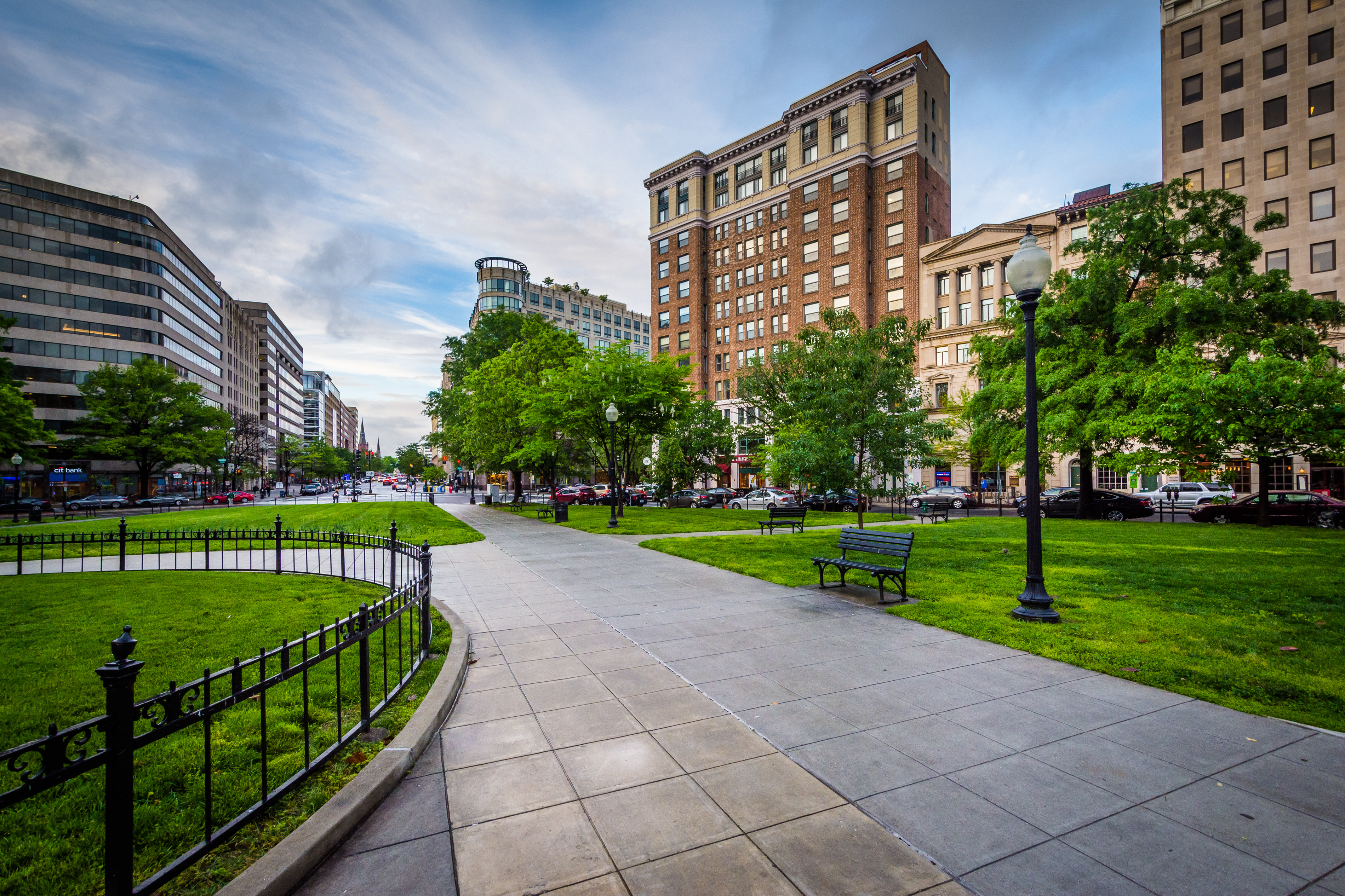Outside path blanked by benches, lights, and buildings