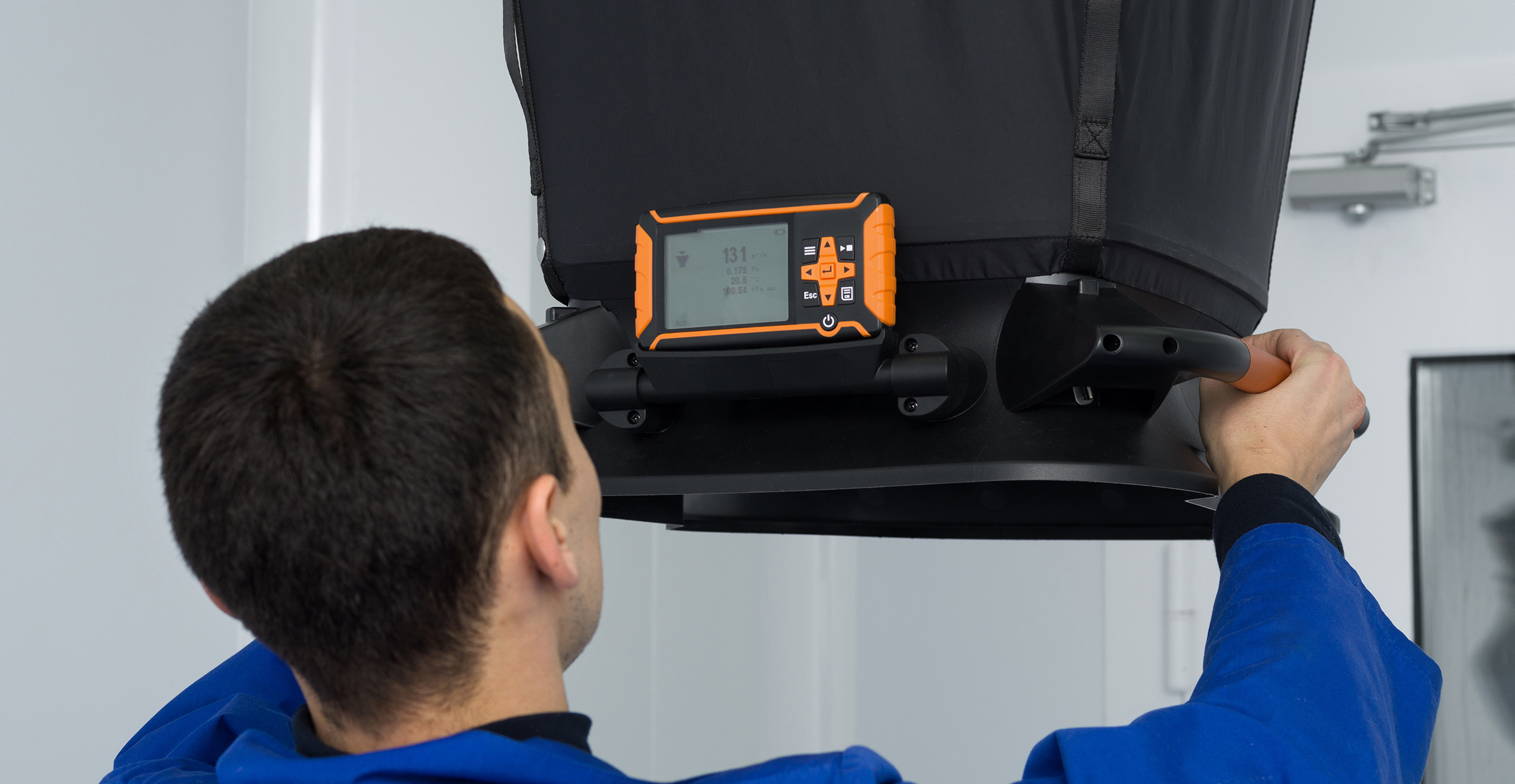 Engineer completeing wind speed measurement