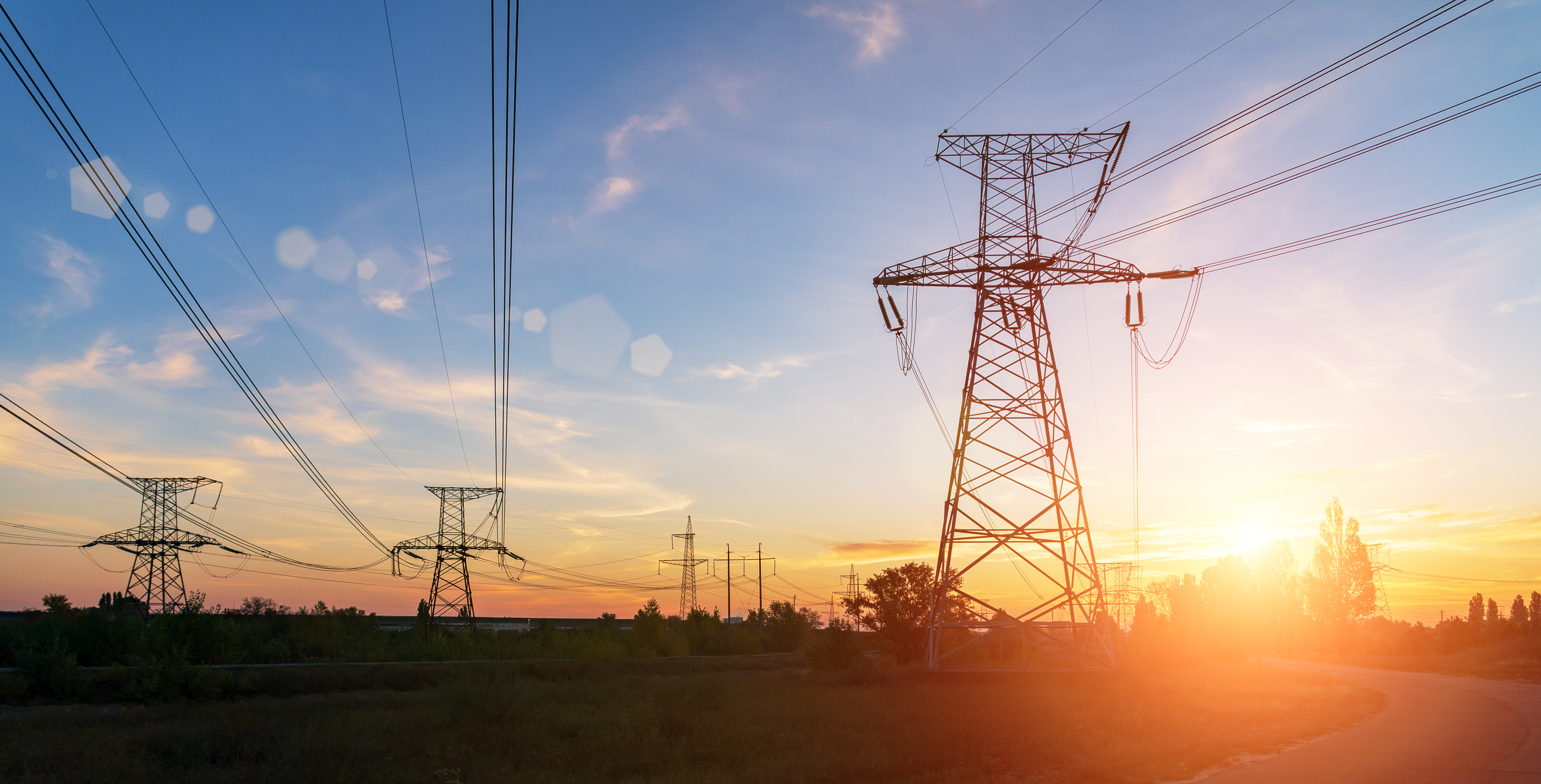 Powerlines infront of a sunrise