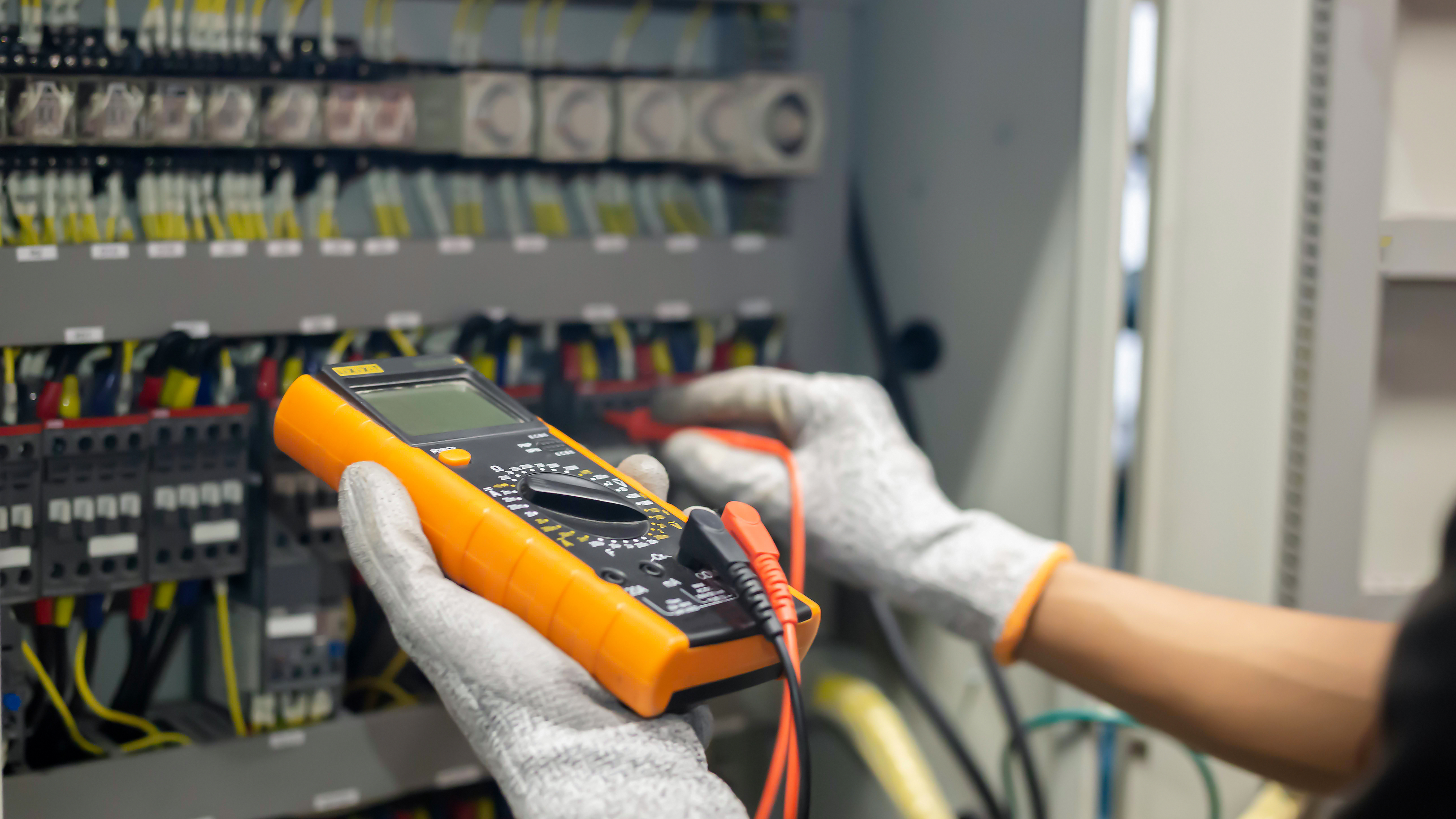 Meter being used to test equipment