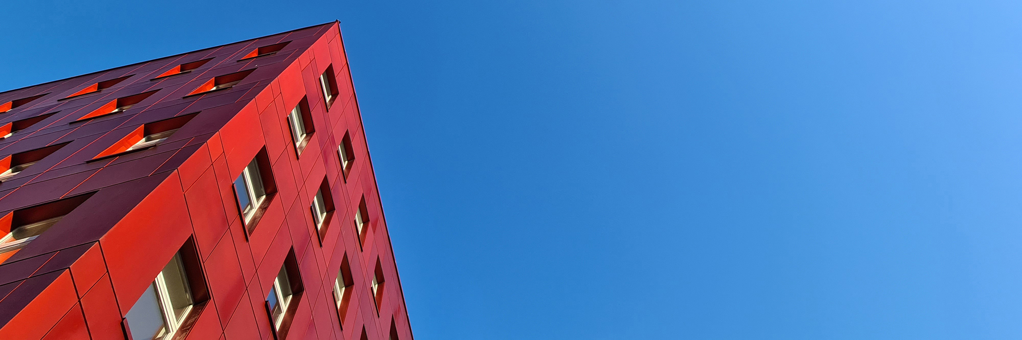 Modern red building with blue sky