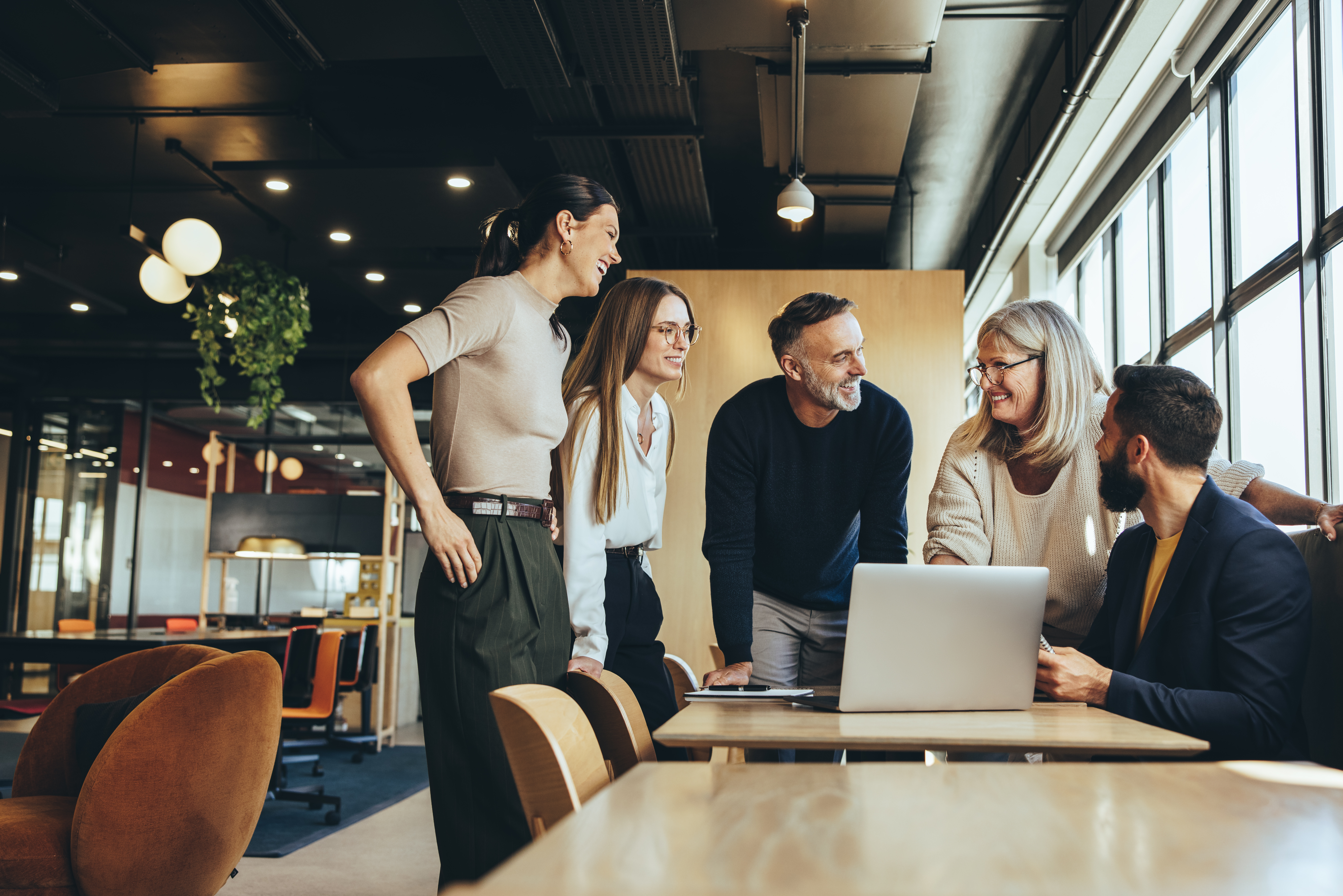 Employees meeting with laptop